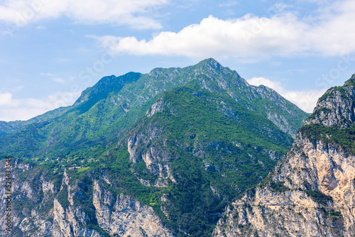 Wooded mountain top and rock wall on the northern shore of Lake Garda in Italy © were