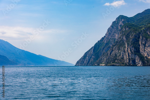 Wooded mountain top and rock wall on the northern shore of Lake Garda in Italy © were