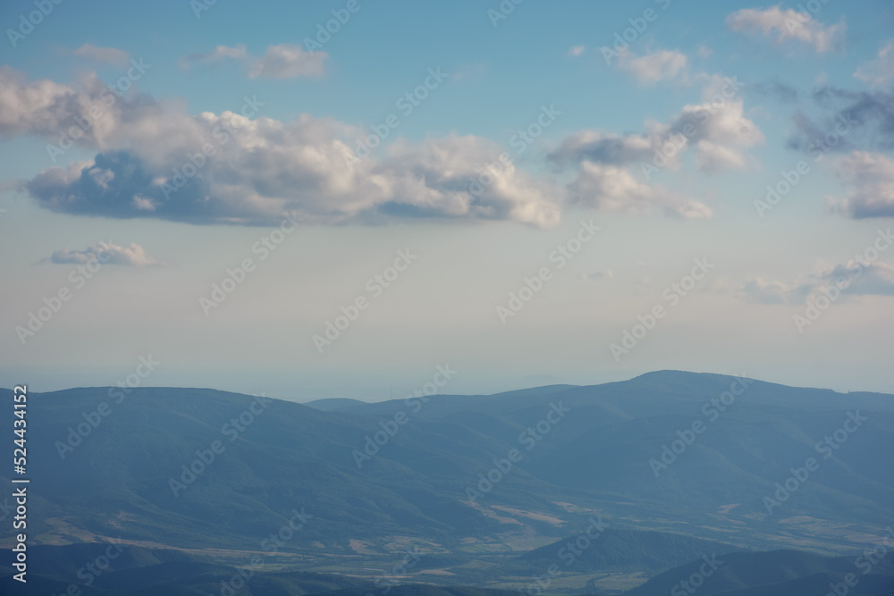 alpine meadows of runa mountain. stunning countryside landscape of trascarpathia in evening light. hill rolling down in to the distance. valley beneath a sky with beautiful cloudscape