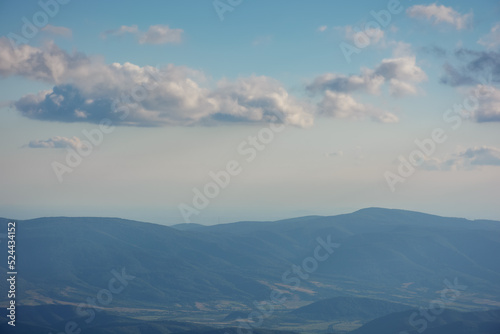 alpine meadows of runa mountain. stunning countryside landscape of trascarpathia in evening light. hill rolling down in to the distance. valley beneath a sky with beautiful cloudscape © Pellinni