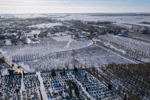 Drone photo of apple orchards and cemetery in Rogow village, Lodz Province of Poland