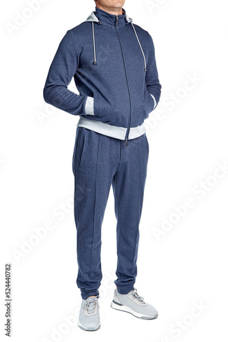 Male model of athletic build in a blue cotton tracksuit, zipper, hooded, full-length, isolated on a white background. Casual sport style.