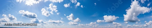 Fototapeta Naklejka Na Ścianę i Meble -  Panoramic view of blue sky with fluffy clouds