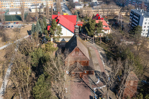 View with wooden church of St Florian and new church in Stalowa Wola city, Poland
