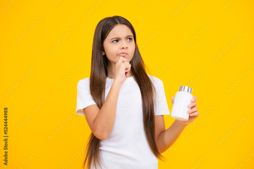 Child hold antibiotics. Healthcare, vitamins and pills. Pharmacy drug store. Teen with illness symptoms. Thinking face, thoughtful emotions of teenager girl. Child hold antibiotics. Healthcare, vitamins and pills. Pharmacy drug store. Teen with illness symptoms. Thinking face, thoughtful emotions of teenager girl.