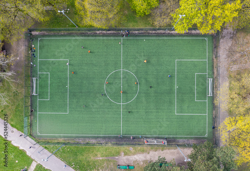 High angle drone view of football field in Agrykola Park in Warsaw city, Poland