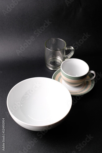 cup and saucer on a black background