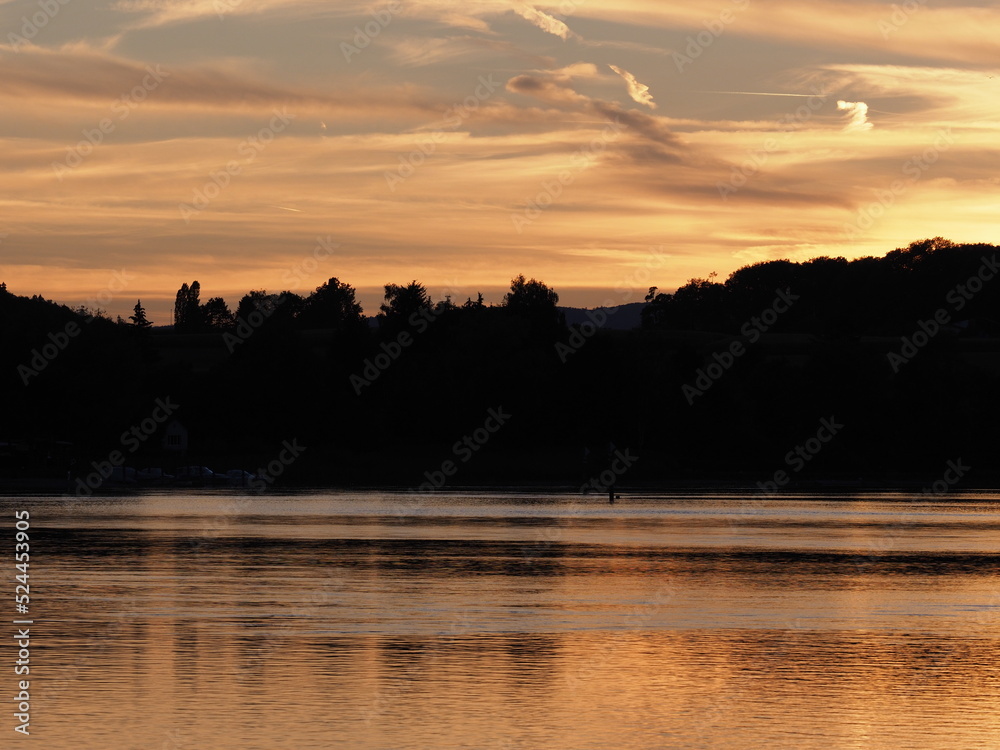 Naklejka premium Romantic sun set over Rhine River near Stein am Rhein in Switzerland