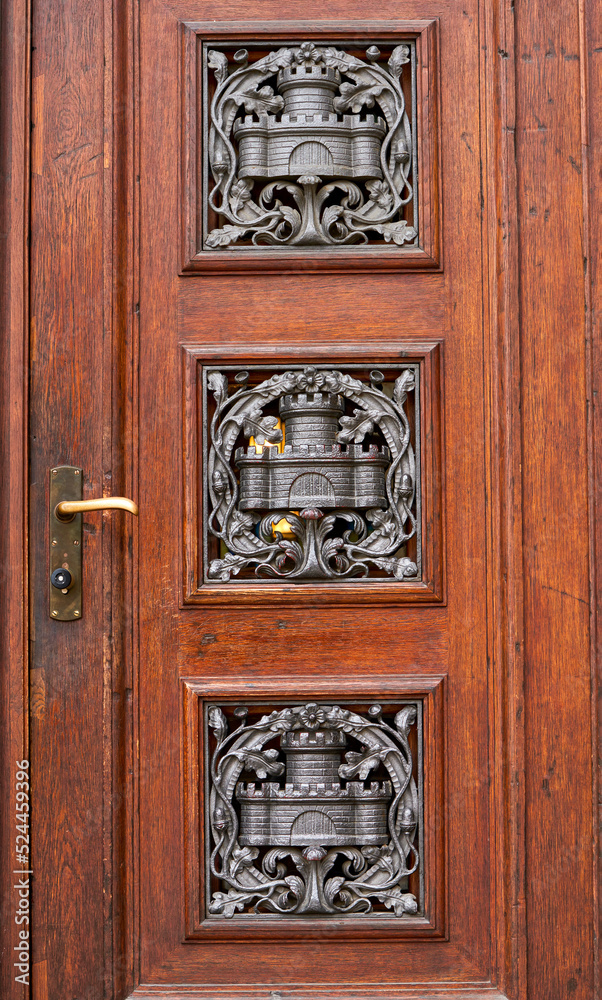 Wooden door with decorative elements in the city center