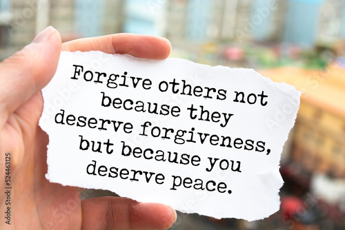 Inspirational motivational quote. Forgive others not because they deserve forgiveness, but because you deserve peace. photo