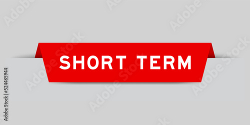 Red color inserted label with word short term on gray background