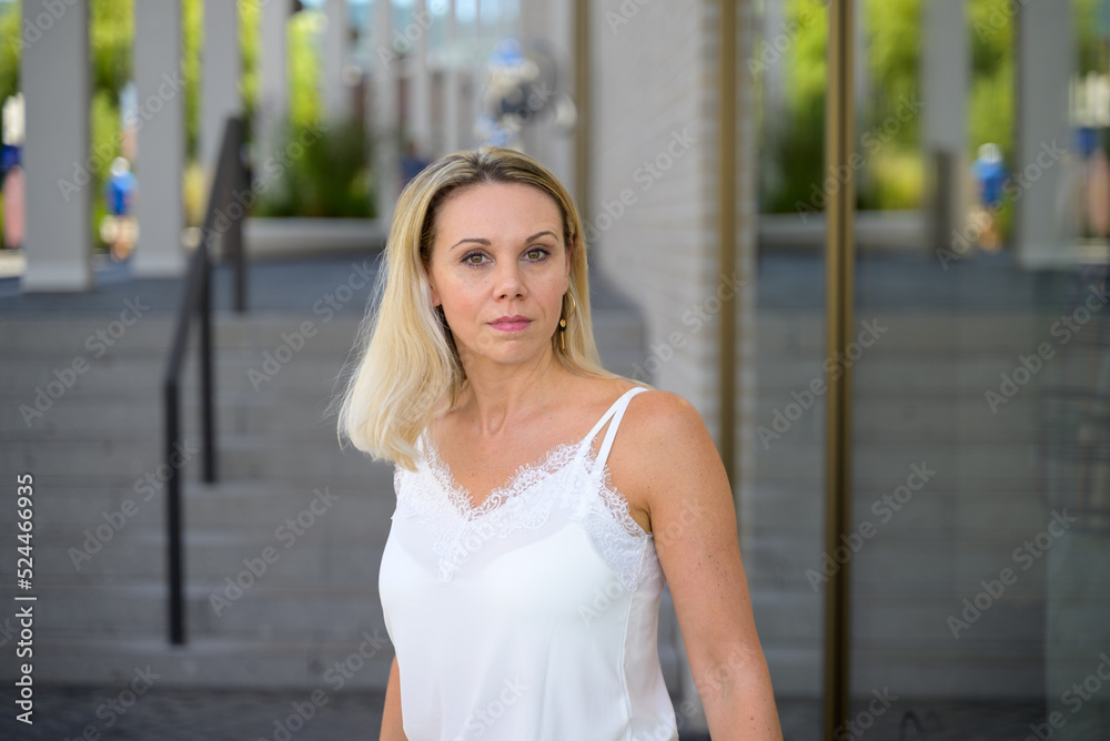 Middle aged blond woman with a troubled intense expression