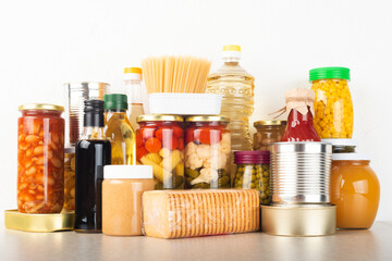 Emergency survival food set on white kitchen table