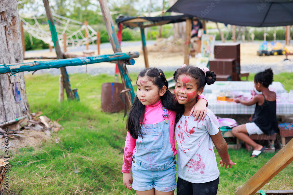 Obraz premium Diverse happiness kid group playing in playground at summer camp learning