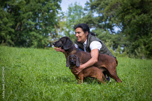 trainer with two tracker dogs