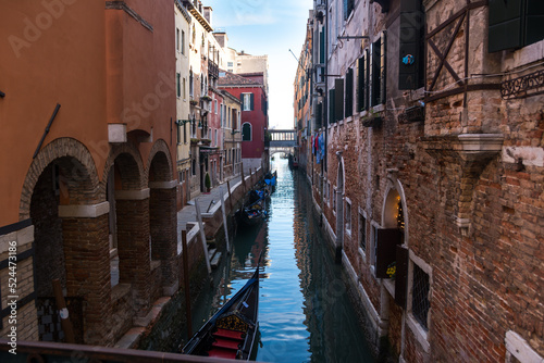 Narrow canal and ancient buildings at Venice, Veneto, Italy. © MANTOVAN