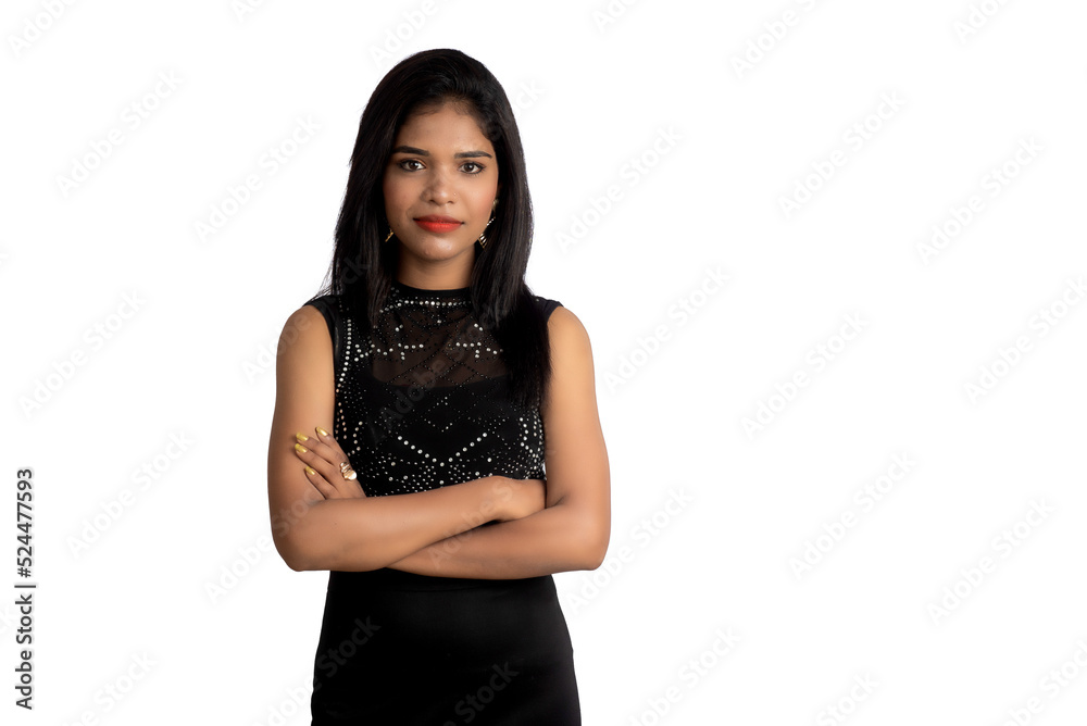 Portrait of a young girl wearing black dress posing on a white background Portrait of a young girl wearing black dress posing on a white background