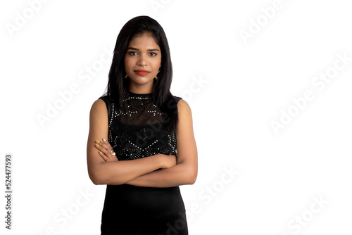 Portrait of a young girl wearing black dress posing on a white background