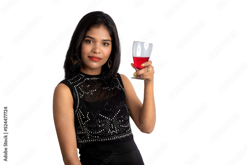 Portrait of a cheerful young woman holding a glass of wine isolated over white background Portrait of a cheerful young woman holding a glass of wine isolated over white background