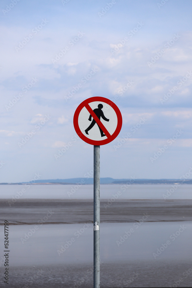 Road sign Pedestrian traffic is prohibited. No entry, no humans allowed sign. Man silhouette in crossed out red circle.