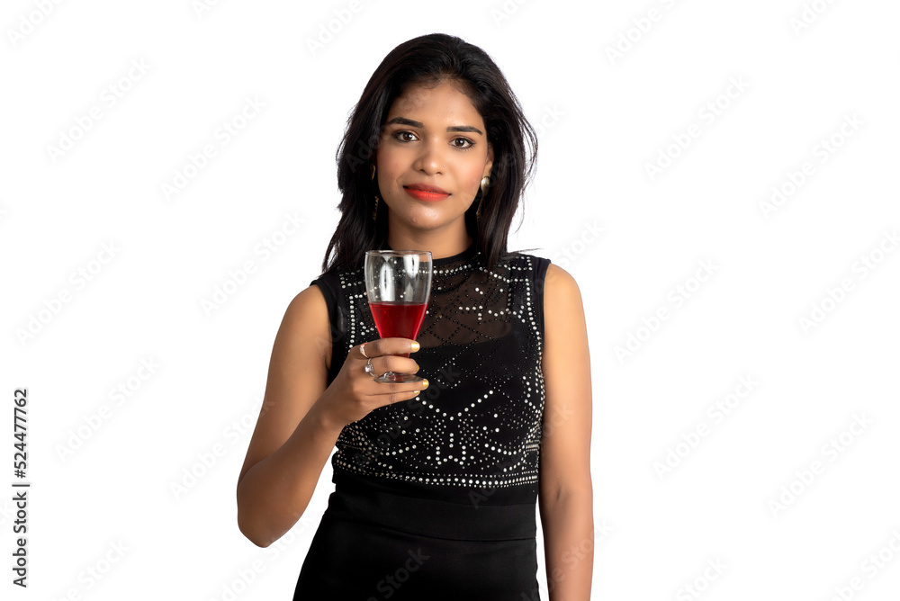 Portrait of a cheerful young woman holding a glass of wine isolated over white background Portrait of a cheerful young woman holding a glass of wine isolated over white background