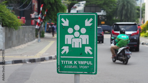 A signboard says "Titik Kumpul" means Assembly Point © Ruud