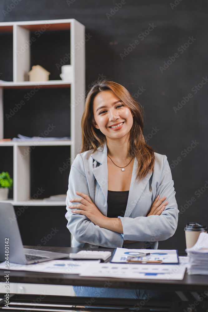 Smiling Asian businesswoman working on laptop in modern office Accountant Concept Finance Expert Analyze Business Report Graph financial chart financial chart corporate economy Banking Market Research Smiling Asian businesswoman working on laptop in modern office Accountant Concept Finance Expert Analyze Business Report Graph financial chart financial chart corporate economy Banking Market Research