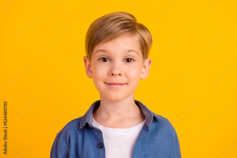 Portrait of satisfied candid person good mood smile look camera isolated on vivid yellow color background Portrait of satisfied candid person good mood smile look camera isolated on vivid yellow color background