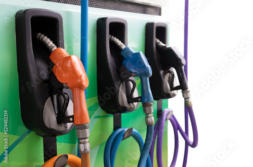 Colorful Petrol pump filling nozzles on Gas station background