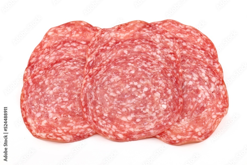 Fototapeta premium Slices of salami Milano on white background. It's a speciality of the city of Milan made of pork, beef and spices.