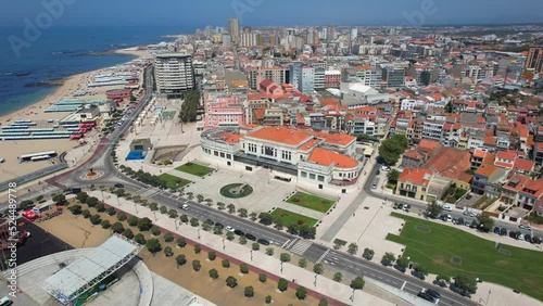 Aerial circle drone view of City of Povoa de Varzim on a bright sunny summer day, Porto region, Portugal. 