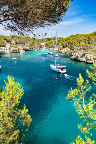 Bay of Cala Figuera with incoming sailing yacht, Mallorca