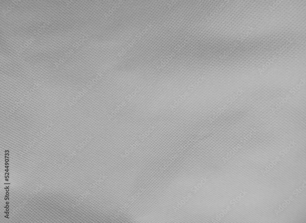coarse porous gray non-woven fabric surface background. polypropylene fabric texture coarse porous gray non-woven fabric surface background. polypropylene fabric texture