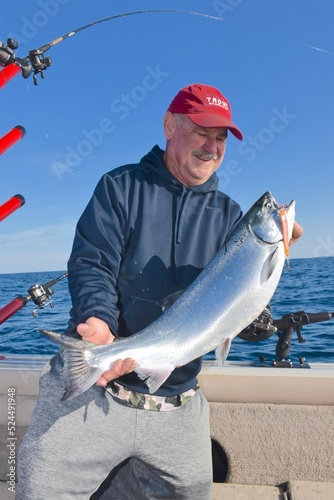 An angler with an exceptional coho salmon 