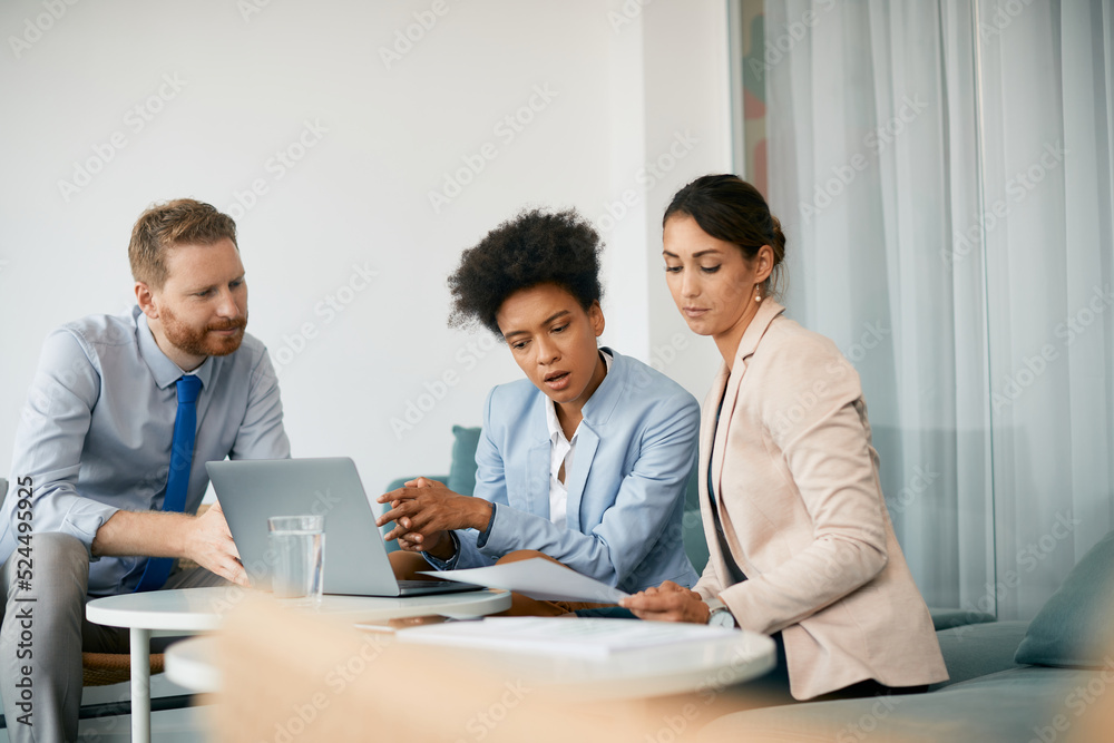 Corporate business team cooperate while working during meeting in office. Corporate business team cooperate while working during meeting in office.