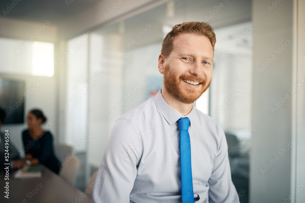Happy male entrepreneur at corporate office looking at camera. Happy male entrepreneur at corporate office looking at camera.