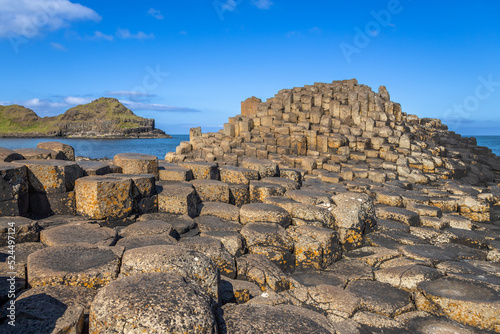 Mountain of hexagonal basalt columns of Giant's Causeway UNESCO World Heritage Site, is an area of about 40,000 interlocking , the result of an ancient volcanic fissure eruption