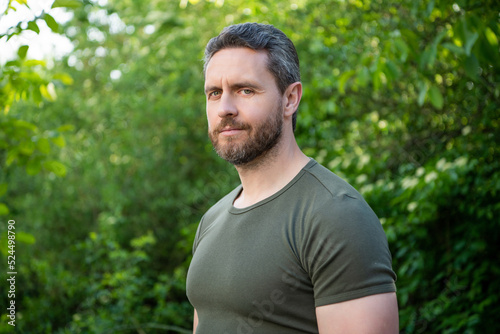 casual man in shirt. caucasian man with beard. mature man outdoor