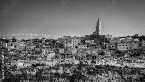 Matera at Sunset, black and white photo of the town of stones. Photo from June 2022. You can see the basilica overlooking the town and the characteristic houses carved into the rock. Matera was the Eu photo