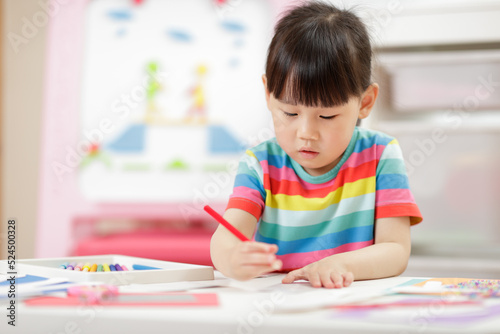  young girl making craft for homeschooling
