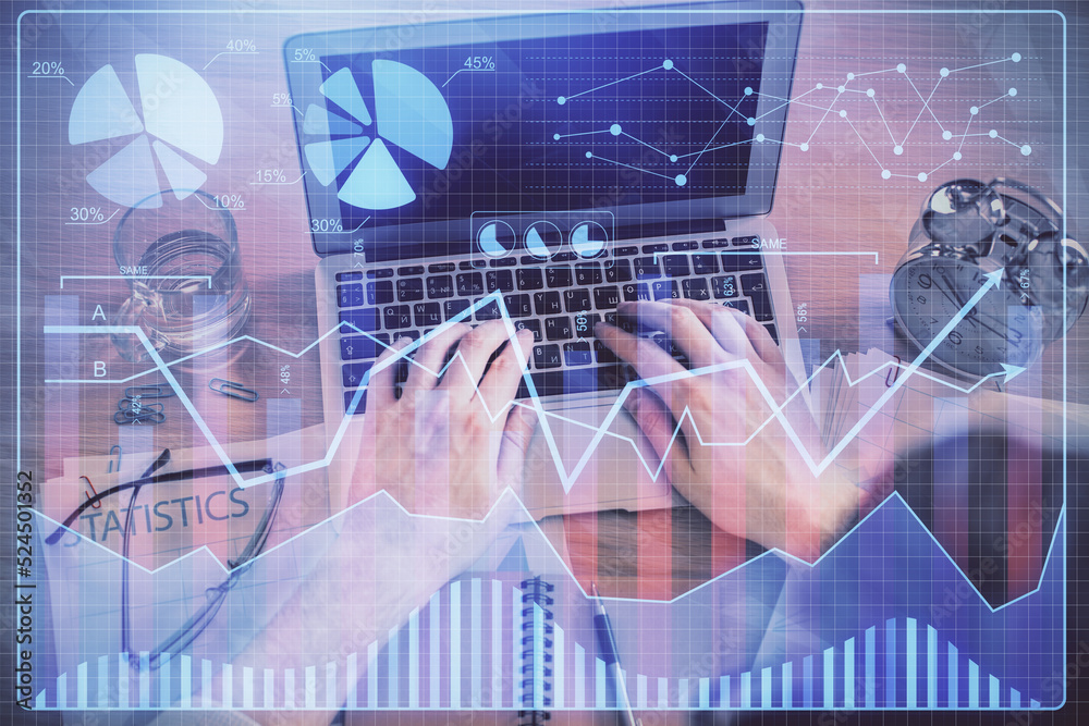 Double exposure of man's hands typing over laptop keyboard and forex chart hologram drawing. Top view. Financial markets concept. Double exposure of man's hands typing over laptop keyboard and forex chart hologram drawing. Top view. Financial markets concept.