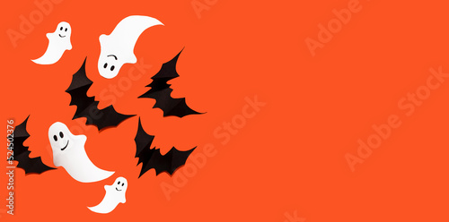 Halloween photo of black bats  ghost on blank orange background. Halloween decoration
