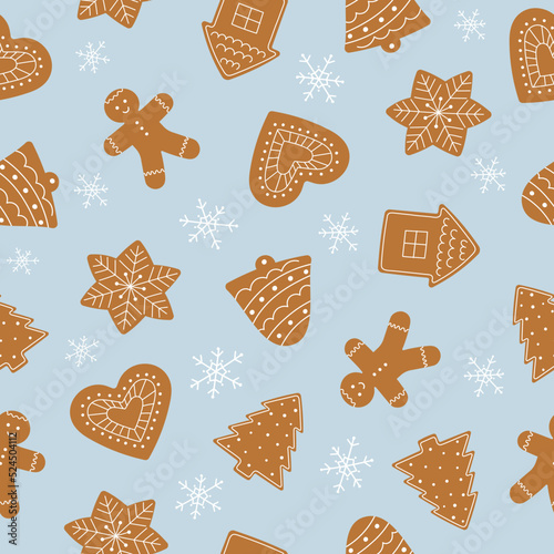 Seamless pattern of gingerbread cookies. Winter homemade sweets on blue background