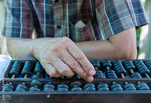 Handling Classic wooden Chinese abacus photo