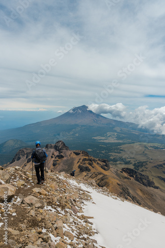 alpinist man going to the top of mountain