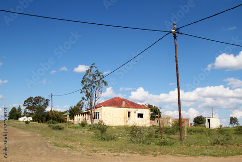 Photo of abandoned old houses and buildings in South Africa, red stone, mud and stone walls