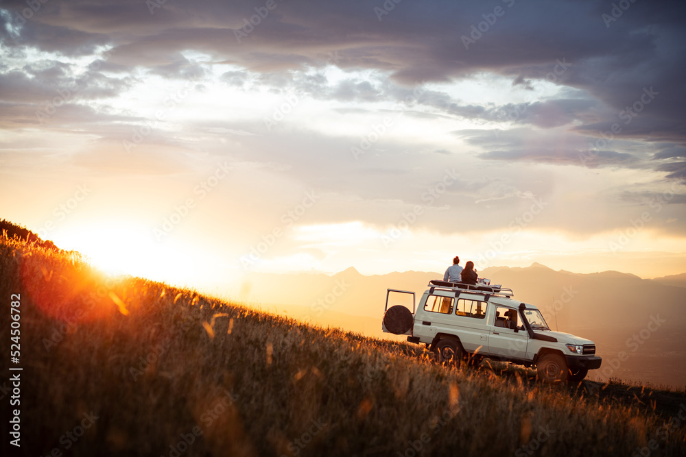 Fototapeta premium People watching sunset on top of 4x4 vehicle in Mountains of Goden, Kosovo