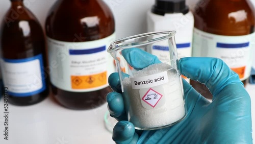 benzoic acid in glass, chemical in the laboratory and industry photo