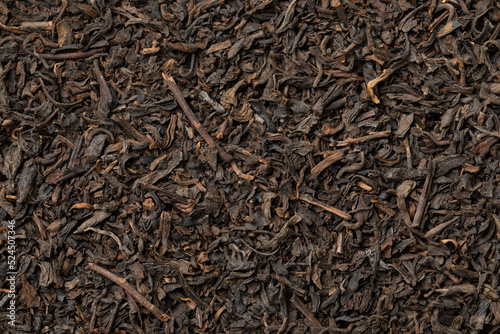 Chinese Pu Ehr dried tea leaves close up full frame as background