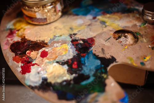 Close up photo of palette and painting brush, painting process